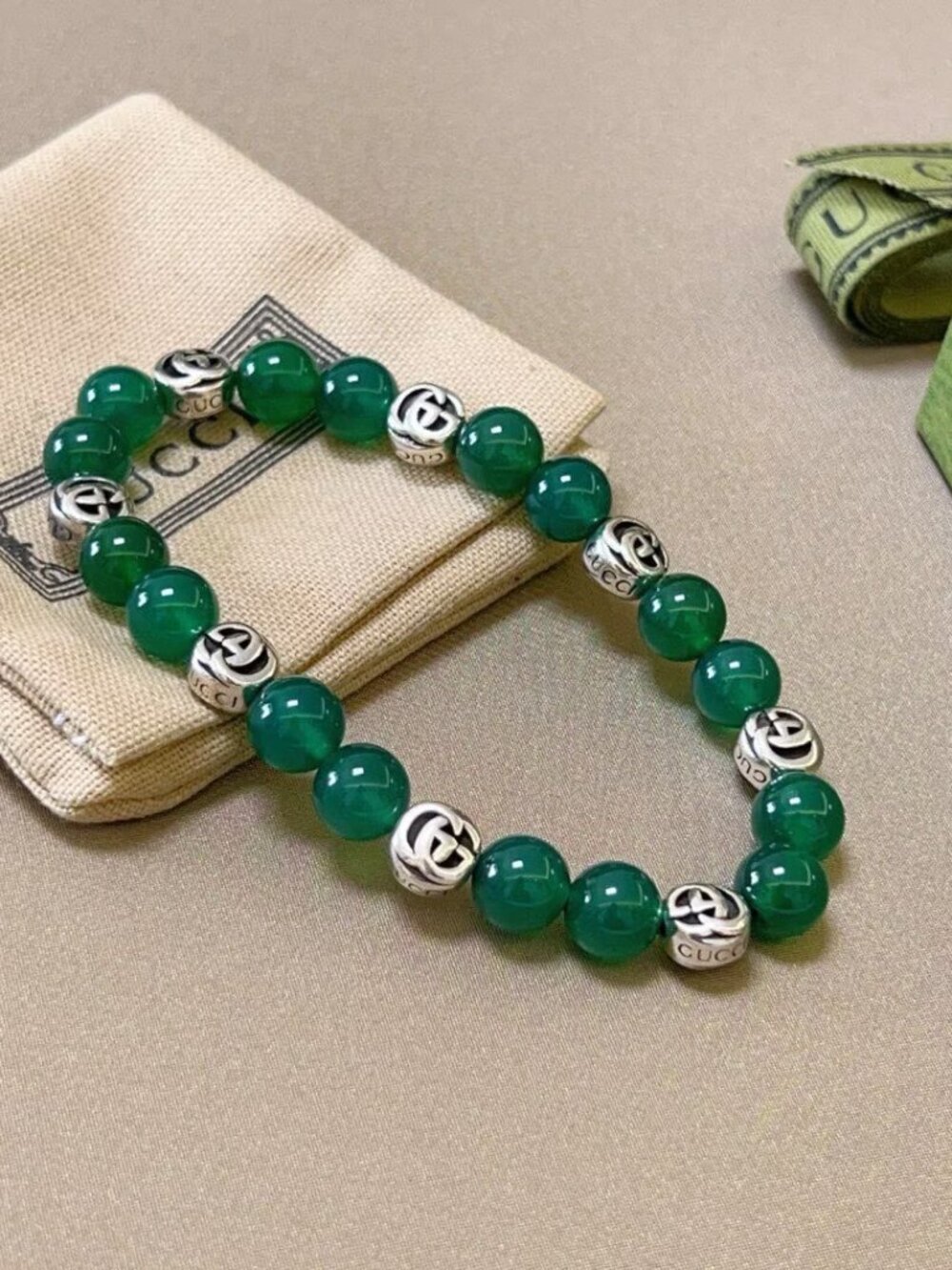 Gucci Green Beaded Bracelet with Silver Logo Charms
